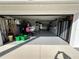 Spacious two-car garage with ample storage, shelving, and laundry area at 1618 Juno Trail, Astor, FL 32102