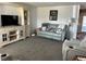 Comfortable living room featuring plush sofa and entertainment center at 1618 Juno Trail, Astor, FL 32102