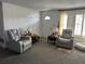 Cozy living room with comfortable seating and natural light at 1618 Juno Trail, Astor, FL 32102