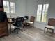 Home office with desk, rolling chair, and natural light streaming through the window at 1618 Juno Trail, Astor, FL 32102