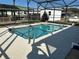 Beautiful in-ground pool with a screened enclosure and patio area perfect for entertaining at 1618 Juno Trail, Astor, FL 32102