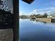 Scenic water view showing the serene waterfront location and surrounding community at 1618 Juno Trail, Astor, FL 32102