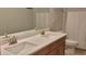 Modern bathroom with double sinks and a large mirror at 16310 Wind View Ln, Winter Garden, FL 34787