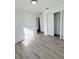 Well-lit bedroom showcasing wood-look floors at 203 Juniper Way, Ocala, FL 34480