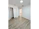 Bright bedroom with wood-look floors and spacious closet at 203 Juniper Way, Ocala, FL 34480