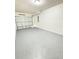 Spacious garage with light gray epoxy flooring at 203 Juniper Way, Ocala, FL 34480