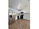 Modern kitchen with stainless steel appliances and white cabinets at 203 Juniper Way, Ocala, FL 34480