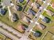 Aerial view of a residential neighborhood featuring neatly arranged homes and well-kept lawns at 2369 Crossandra St, Mascotte, FL 34753