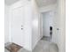 Bright foyer with white walls, tile floors, and views into the home at 2369 Crossandra St, Mascotte, FL 34753