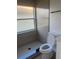 Renovated bathroom with modern tiling, glass enclosed shower and updated fixtures at 2410 Shelby Cir, Kissimmee, FL 34743