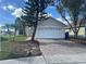 Charming single-story home featuring a two-car garage and well-maintained landscaping at 2410 Shelby Cir, Kissimmee, FL 34743