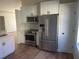 Stainless steel appliances with white cabinets and subway tile back splash at 2410 Shelby Cir, Kissimmee, FL 34743