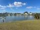 Beautiful lake view showcasing the community homes across the tranquil water at 2410 Shelby Cir, Kissimmee, FL 34743