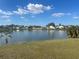 Tranquil lake view from the backyard, enhancing the home's appeal at 2410 Shelby Cir, Kissimmee, FL 34743