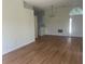Bright, open-concept living space with wood flooring and an inviting atmosphere at 2410 Shelby Cir, Kissimmee, FL 34743