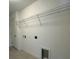 The laundry room features practical storage shelves and convenient hookups for appliances at 277 Harper Estates Cir, Lake Wales, FL 33859