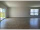 Expansive living room with large windows and sliding glass door to outdoor space at 277 Harper Estates Cir, Lake Wales, FL 33859