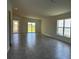 Spacious living room with tile flooring, natural light, and sliding door access to the backyard at 277 Harper Estates Cir, Lake Wales, FL 33859