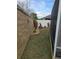 Landscaped backyard with block wall and grass at 3362 Sebastion Ave, The Villages, FL 32163