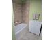 Bathroom with a bathtub and tile shower surround at 3362 Sebastion Ave, The Villages, FL 32163