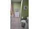 Clean bathroom with green walls and tile flooring at 3362 Sebastion Ave, The Villages, FL 32163