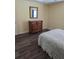 Bedroom with wood dresser and a large mirror at 3362 Sebastion Ave, The Villages, FL 32163