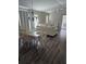 Charming dining room with hardwood floors and a chandelier at 3362 Sebastion Ave, The Villages, FL 32163