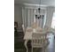 Dining room features a white table and four chairs at 3362 Sebastion Ave, The Villages, FL 32163