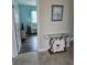 Bright entryway with glass-top console table and view to living area at 3362 Sebastion Ave, The Villages, FL 32163