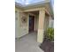 Inviting front entry with a red door and decorative wall art at 3362 Sebastion Ave, The Villages, FL 32163