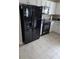 Kitchen features black Whirlpool appliances and white cabinets at 3362 Sebastion Ave, The Villages, FL 32163