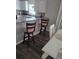 Kitchen with white cabinets and breakfast bar at 3362 Sebastion Ave, The Villages, FL 32163