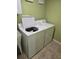 Bright laundry room with front load washer and dryer at 3362 Sebastion Ave, The Villages, FL 32163