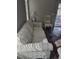 Living room with striped sofa and glass-top coffee table at 3362 Sebastion Ave, The Villages, FL 32163