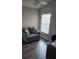 Home office features a comfortable chair and a wooden desk at 3362 Sebastion Ave, The Villages, FL 32163