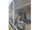 Covered patio with wicker furniture and ceiling fan at 3362 Sebastion Ave, The Villages, FL 32163