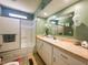 Updated bathroom featuring a tub/shower and ample counter space at 408 Hawthorne Blvd, Leesburg, FL 34748