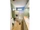 Bathroom with tub/shower, toilet, and vanity with sink at 408 Hawthorne Blvd, Leesburg, FL 34748
