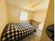 Cozy bedroom with a comfortable bed and built-in workspace at 408 Hawthorne Blvd, Leesburg, FL 34748