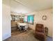 Bright dining room with a round table, four chairs, and a hutch at 408 Hawthorne Blvd, Leesburg, FL 34748