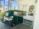 Golf cart parked near the entrance of a manufactured home at 408 Hawthorne Blvd, Leesburg, FL 34748