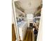 Laundry room with washer, dryer, and ample shelving at 408 Hawthorne Blvd, Leesburg, FL 34748