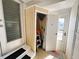 Small storage room with gardening tools and step ladder at 408 Hawthorne Blvd, Leesburg, FL 34748