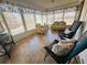 Relaxing sunroom featuring wicker furniture and large windows at 408 Hawthorne Blvd, Leesburg, FL 34748