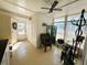 Bright sunroom with tiled floor and patio access at 408 Hawthorne Blvd, Leesburg, FL 34748