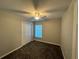 Comfortable bedroom with neutral paint, ceiling fan, closet, and carpeted flooring at 412 Avenue M Ne, Winter Haven, FL 33881