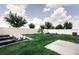 Well-maintained backyard featuring a healthy lawn and white vinyl fence at 414 Taft Dr, Davenport, FL 33837
