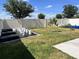 Large fenced backyard with a garden area, perfect for outdoor activities and relaxation at 414 Taft Dr, Davenport, FL 33837