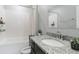 Bright bathroom featuring a shower-tub combination and a granite-topped vanity at 414 Taft Dr, Davenport, FL 33837
