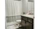 Well-appointed bathroom with granite countertops, a shower-tub combo, and modern fixtures at 414 Taft Dr, Davenport, FL 33837